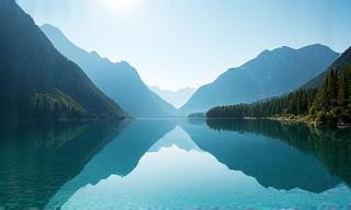 Crystal clear lake reflecting alpine scenery in Salzkammergut